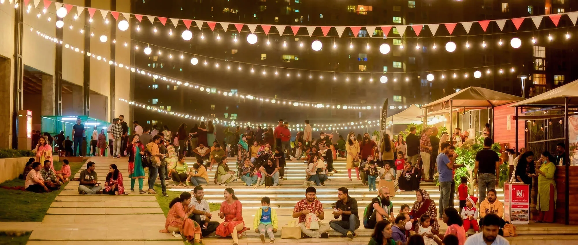 Evening crowd at the open-air venue in Bhartiya City