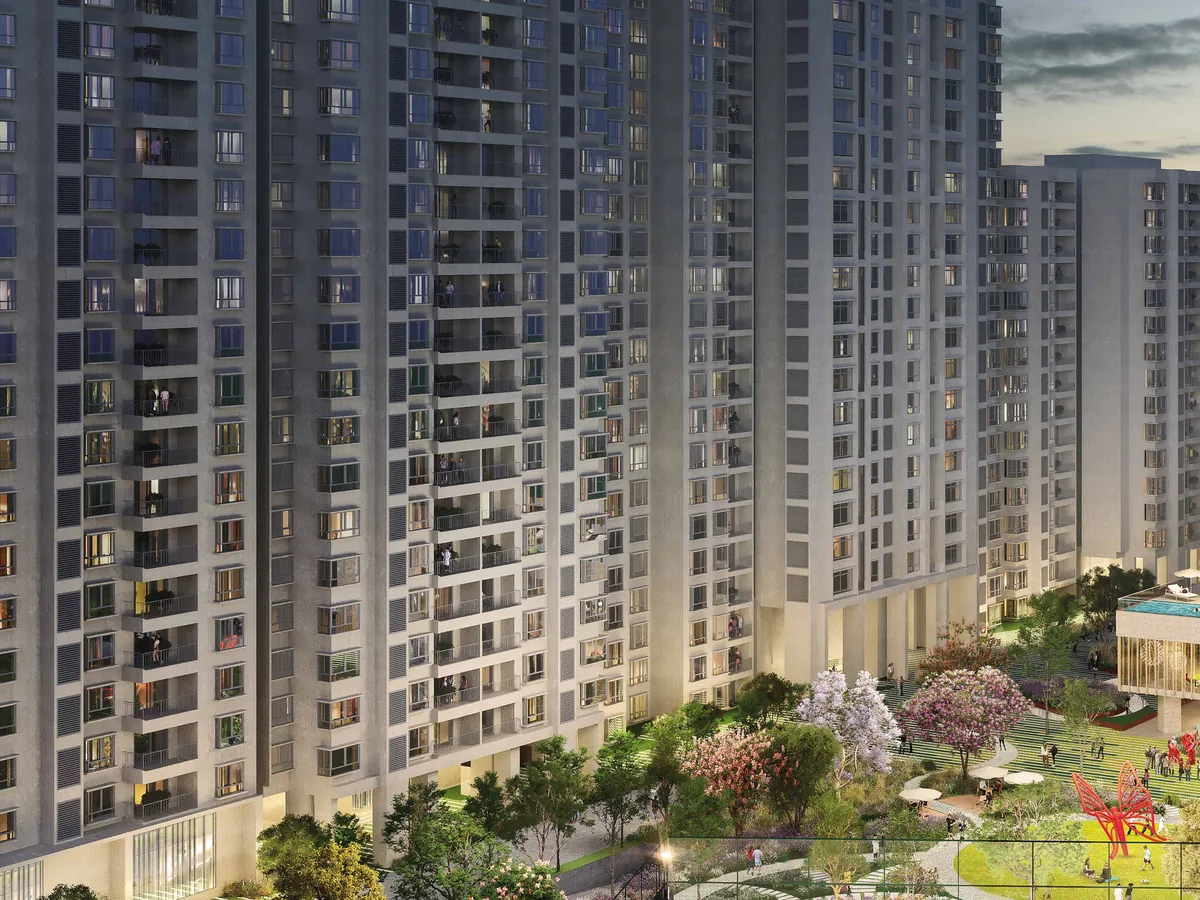 Residential towers of Nikoo Homes 8 rising above the landscaped podium