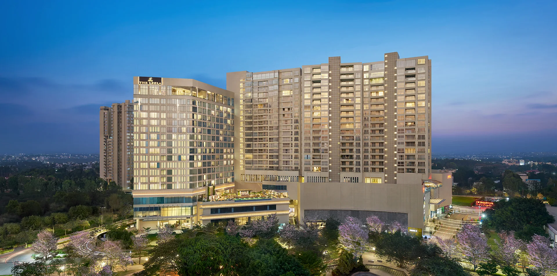 The Leela Bhartiya City hotel at dusk